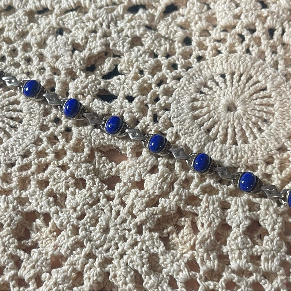 Silver (925) bracelet with blue stones.